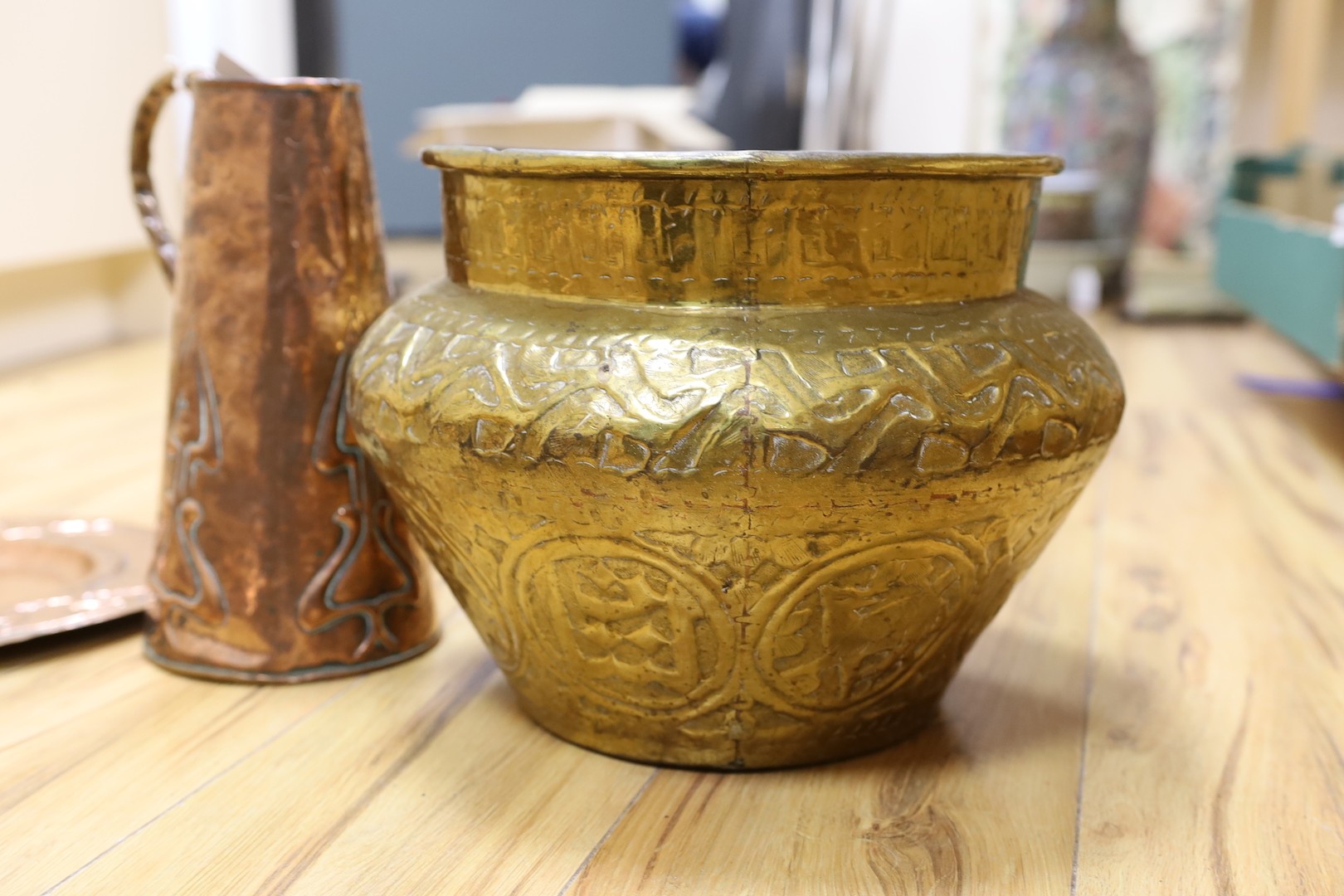 Metalware including embossed copper tray and jug, brass jardiniere, two mortars and pestle (7)